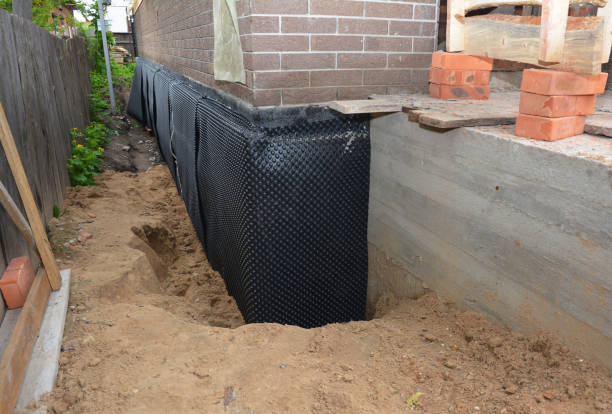 SJ Waterproofing Pros technician performing targeted Basement Waterproofing assessment in Mendota, MN